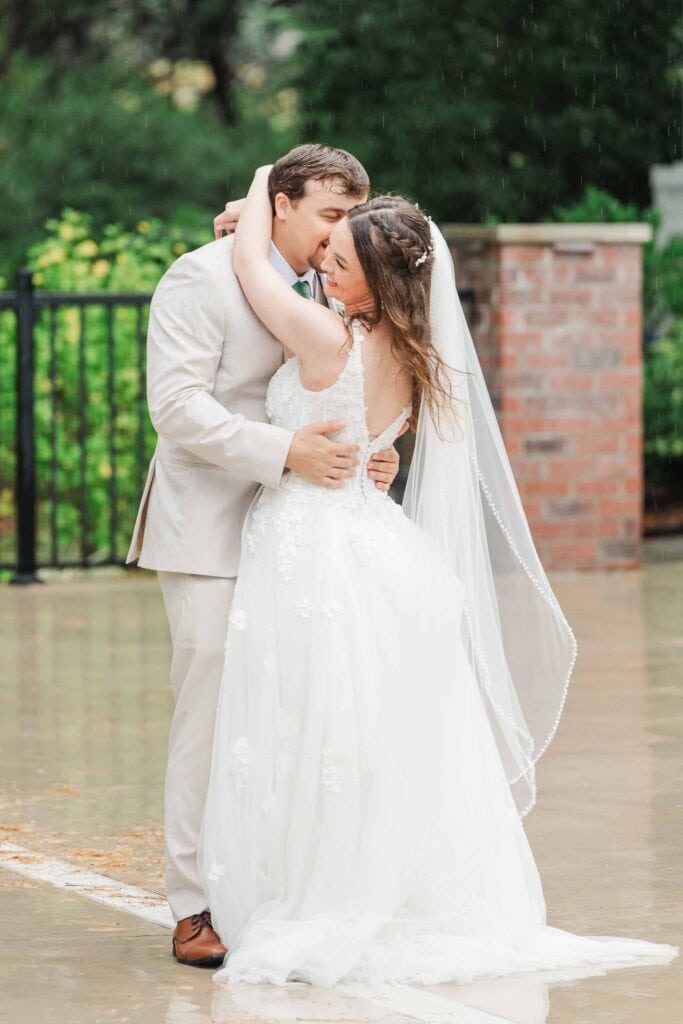 Couple twirling outside during wedding reception at Heron Hill Venue