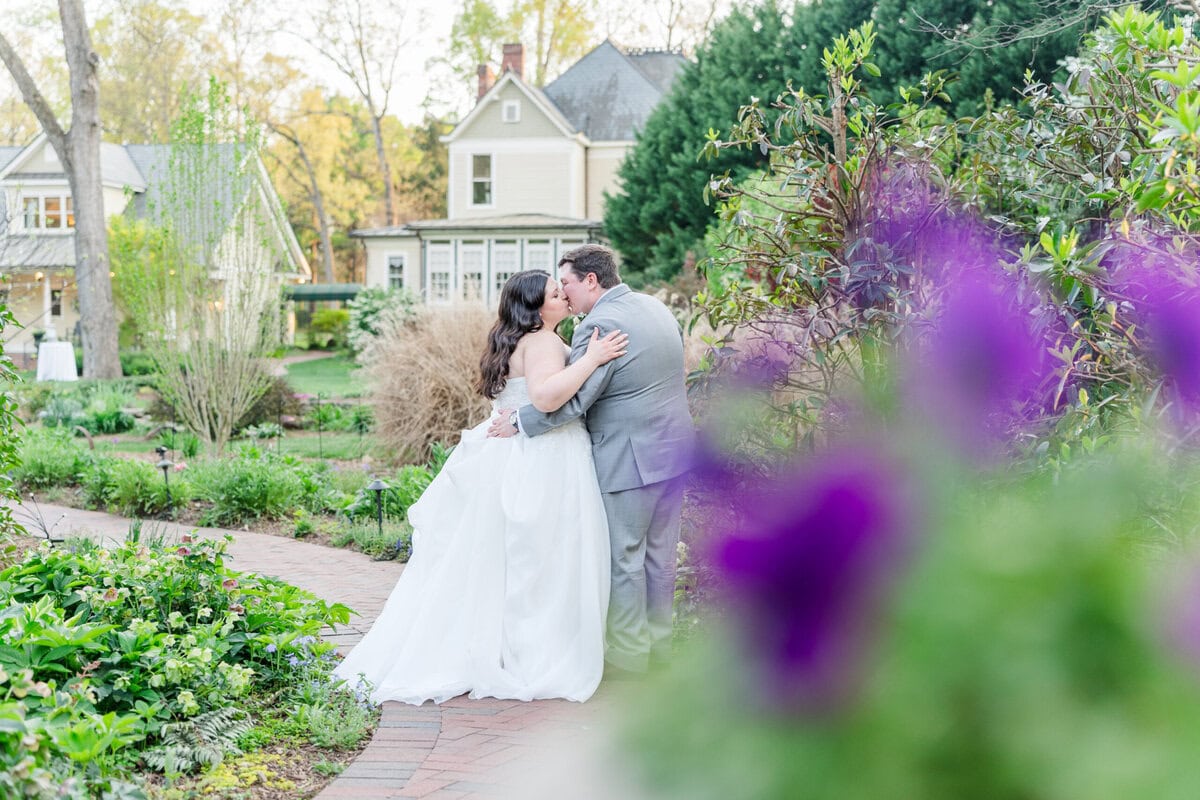Wedding couple portrait in manicured gardens at Alexander Homestead Wedgewood Weddings