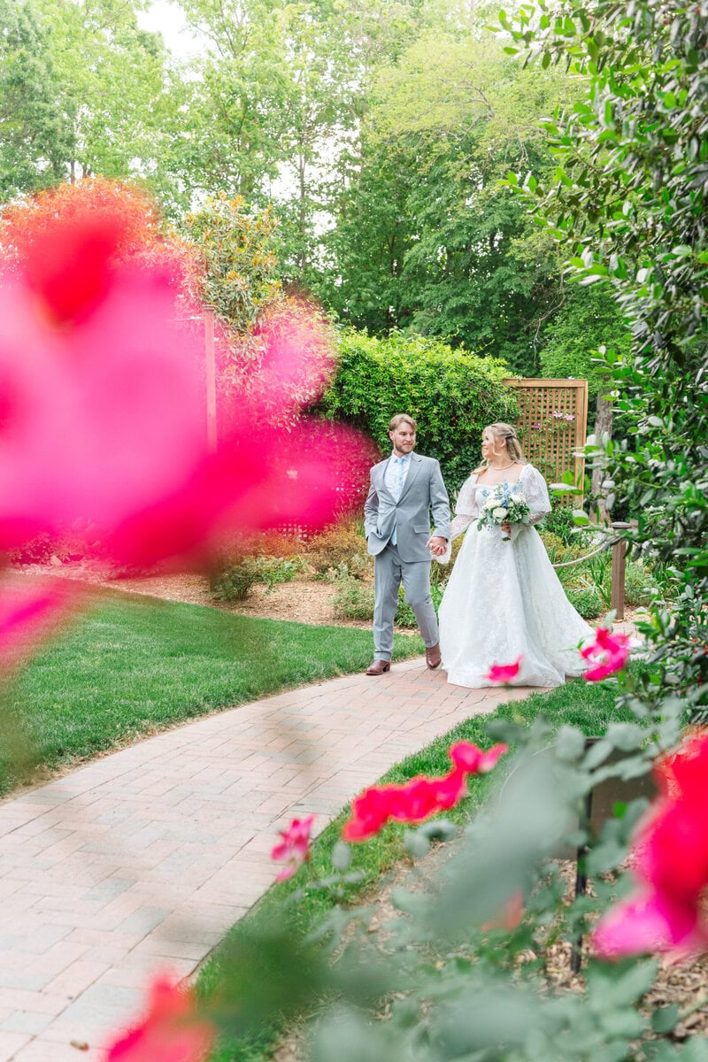Bride and groom romantic portrait near heritage roses at Alexander Homestead by Wedgewood Weddings, North Carolina wedding photographer
