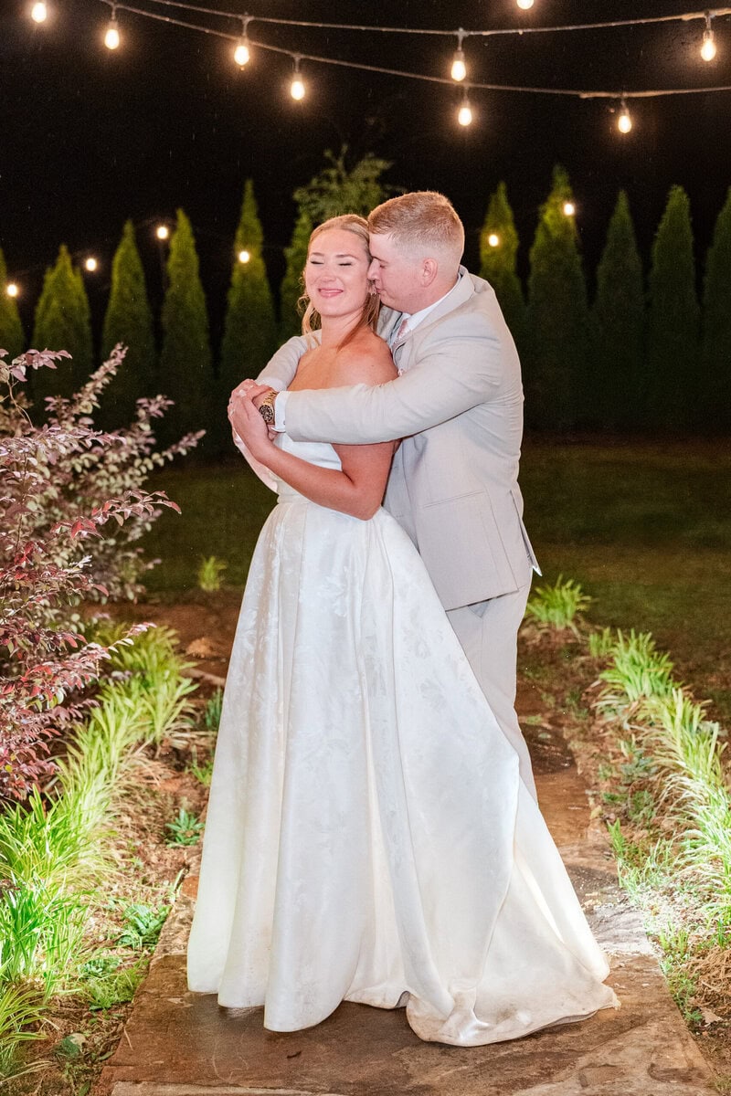 romantic night wedding portrait rain Mariposa Chapel Iron Station NC little white chapel