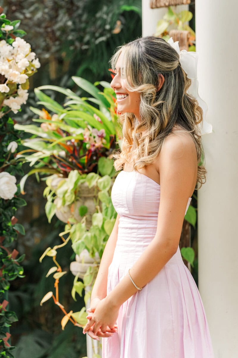 Bride to be in pale pink dress during surprise proposal portrait session at Daniel Stowe Botanical Garden Charlotte area wedding and proposal photographer
