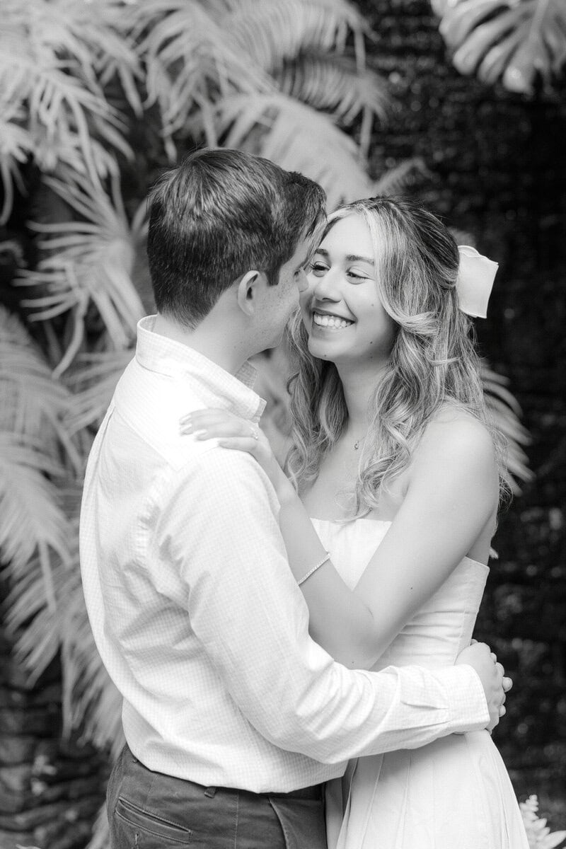 Emotional close up portrait of engaged couple inside the Orchid Conservatory at Daniel Stowe Botanical Garden Belmont North Carolina Charlotte wedding photographer