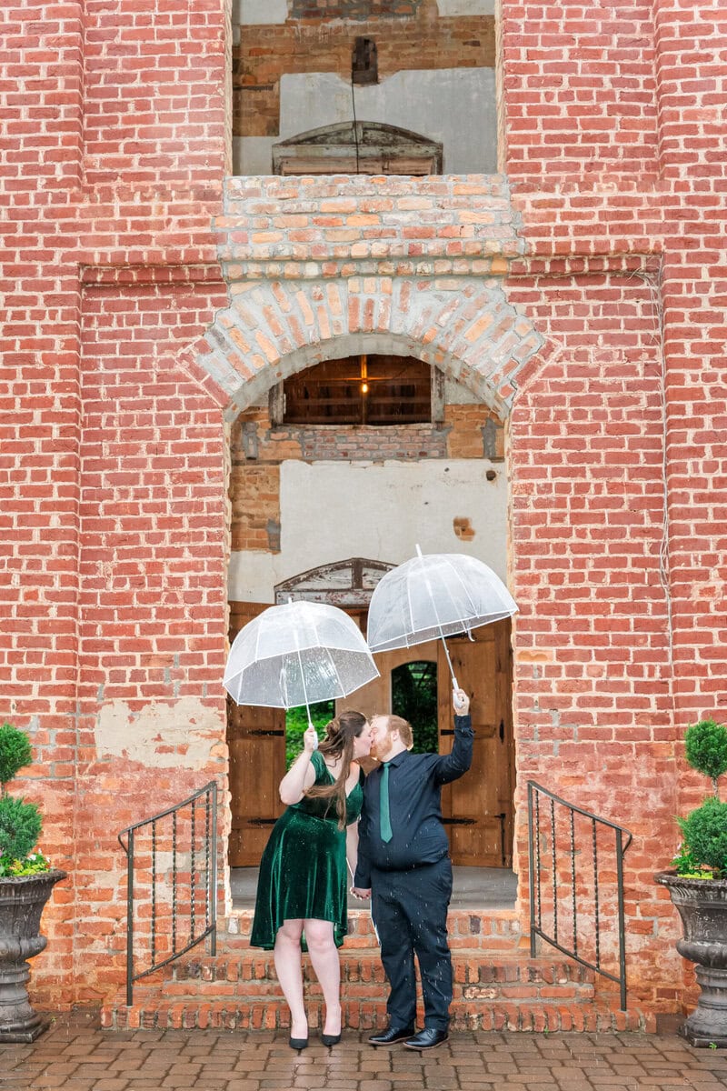 Charlotte NC engagement photographer capturing rainy session at The Providence Cotton Mill