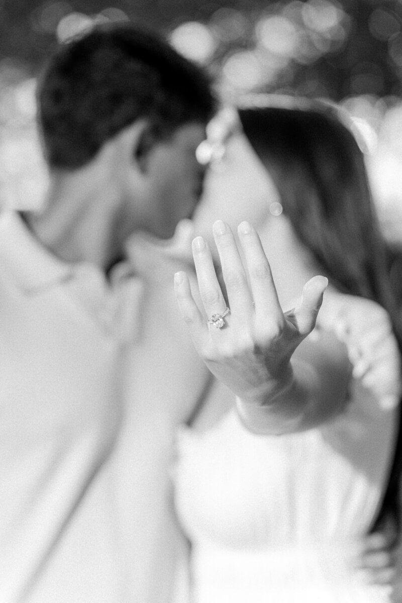 Close up of engagement ring during natural engagement session in Uptown Charlotte