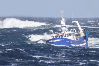 Fishing boat in stormy seas