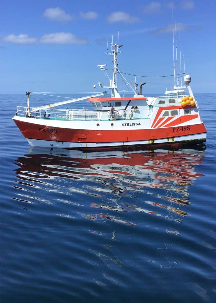 Fishing vessel Stella on calm sea, commercial fishing industry, gear, port, catches, crew, equipment.