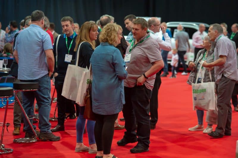 First-time exhibitors at Scottish Skipper Expo engaging with industry professionals in a trade show.