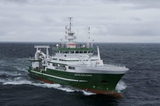 Fishing vessel Celtic Explorer navigating open sea, commercial fishing industry vessel.