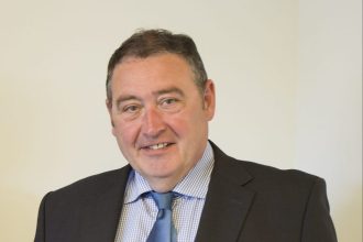 Businessman in suit and tie, professional portrait, commercial fishing industry context, industry or.