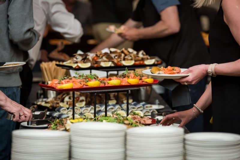 No fishing vessels or gear, image shows a buffet with seafood dishes at a commercial fishing event.