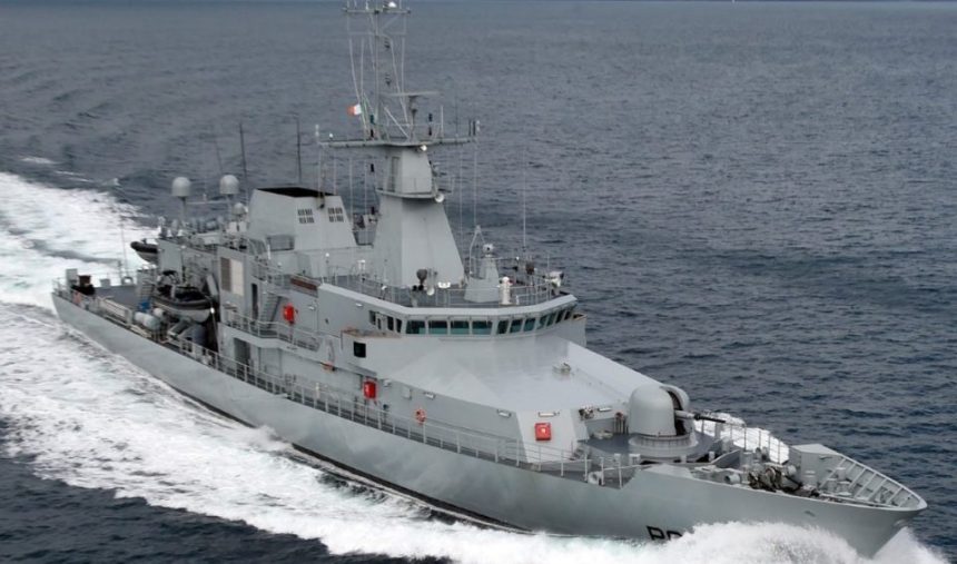 Military fishing vessel in open sea, commercial fishing industry context, industry equipment visible.