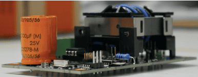 Close-up of electronic components on a fishing vessel control panel in a commercial fishing industry.