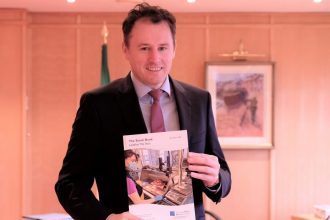 Official presenting a report on fishing industry sustainability at a government meeting, commercial,.