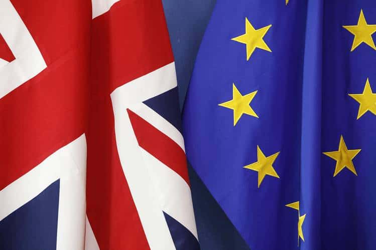 No fishing vessels in this image, only UK and EU flags displayed together in a commercial fishing行业.