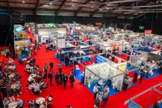 Commercial fishing industry exhibition with fishing vessels, gear, and industry equipment on display.