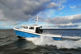 Fishing vessel cruising through open water in a commercial fishing industry setting with industry-fo.
