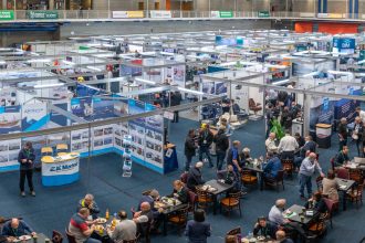 Commercial fishing industry exhibition with fishing vessels, gear, and industry equipment on display.