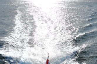 Commercial fishing vessel Valentina navigating open waters, industry equipment visible, March 2022.