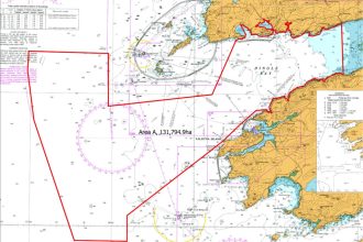 Commercial fishing vessels near Valentia Island, Ireland, with gear and industry equipment in port,.