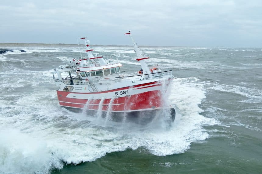 Fishing vessel Ocean Crest S 381 navigating rough seas in a commercial fishing industry setting.