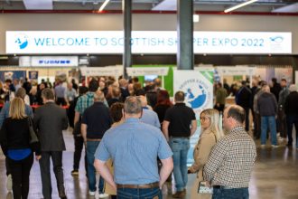 Commercial fishing vessels at Scottish Shrimp Expo 2022, industry equipment and port gear visible in.
