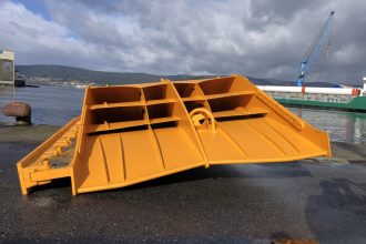 Commercial fishing vessel gear component at port, industry equipment, industry publication focus, no.
