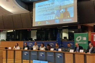 Panel discussion at a conference on commercial fishing industry, with industry representatives and a.