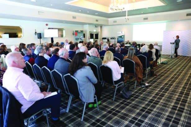 Fishermen industry conference with audience and speaker in a hotel conference room.
