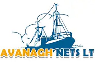 Commercial fishing vessel with gear at port, industry equipment, and crew in a fishing industry port.