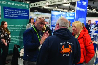 Fishermen and industry professionals at Scottish Skipper Expo 2026 discussing commercial fishing VMS.