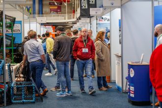 Attendees at Irish Skipper Expo 2027 networking at exhibition booths.