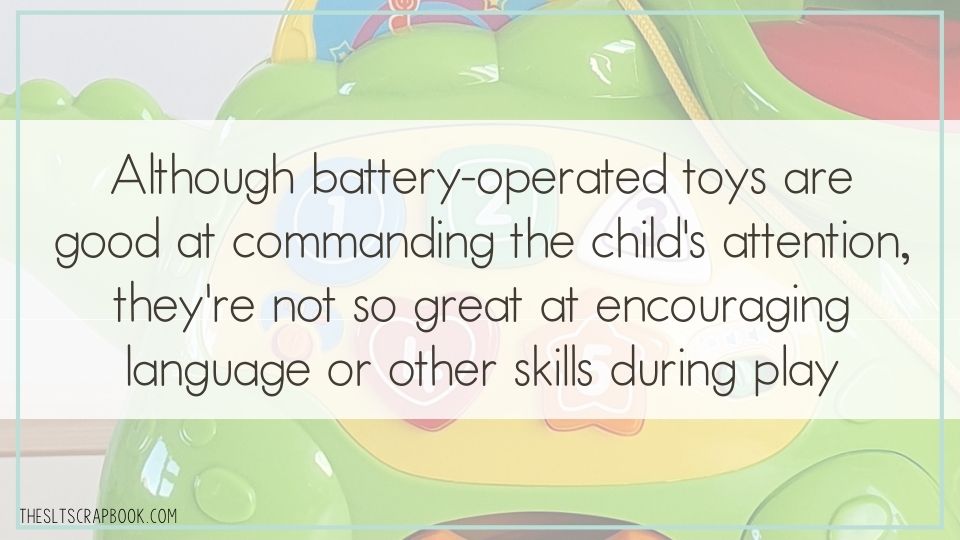 In the background is a faded image of a child's battery-operated toy. The text overlay reads, "although battery operated toys are good at commanding the child's attention, they're not so great at encouraging language or other skills during play"