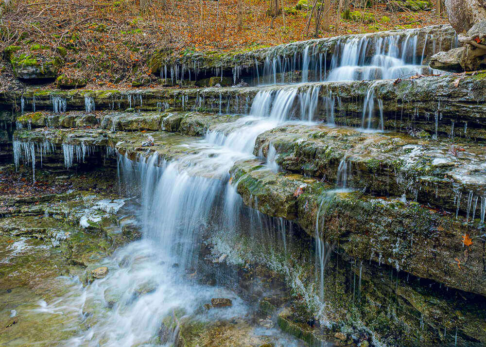 cold morning at a waterfall forming icicles