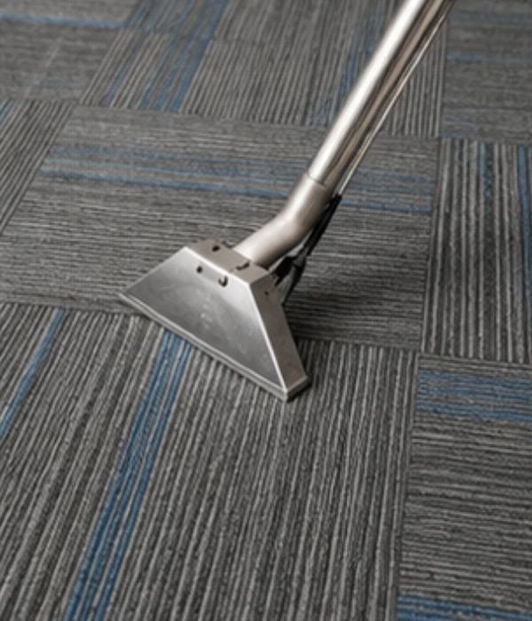 Carpet cleaning machine cleaning a commercial carpet floor.