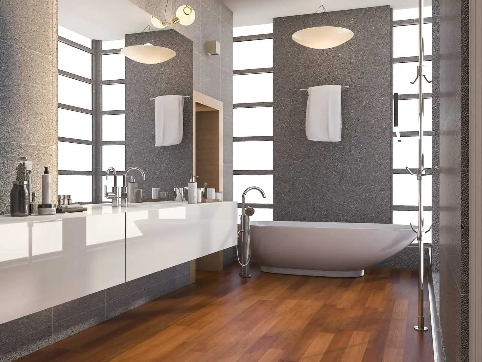Modern bathroom with white bathtub, double vanity, and wooden floor