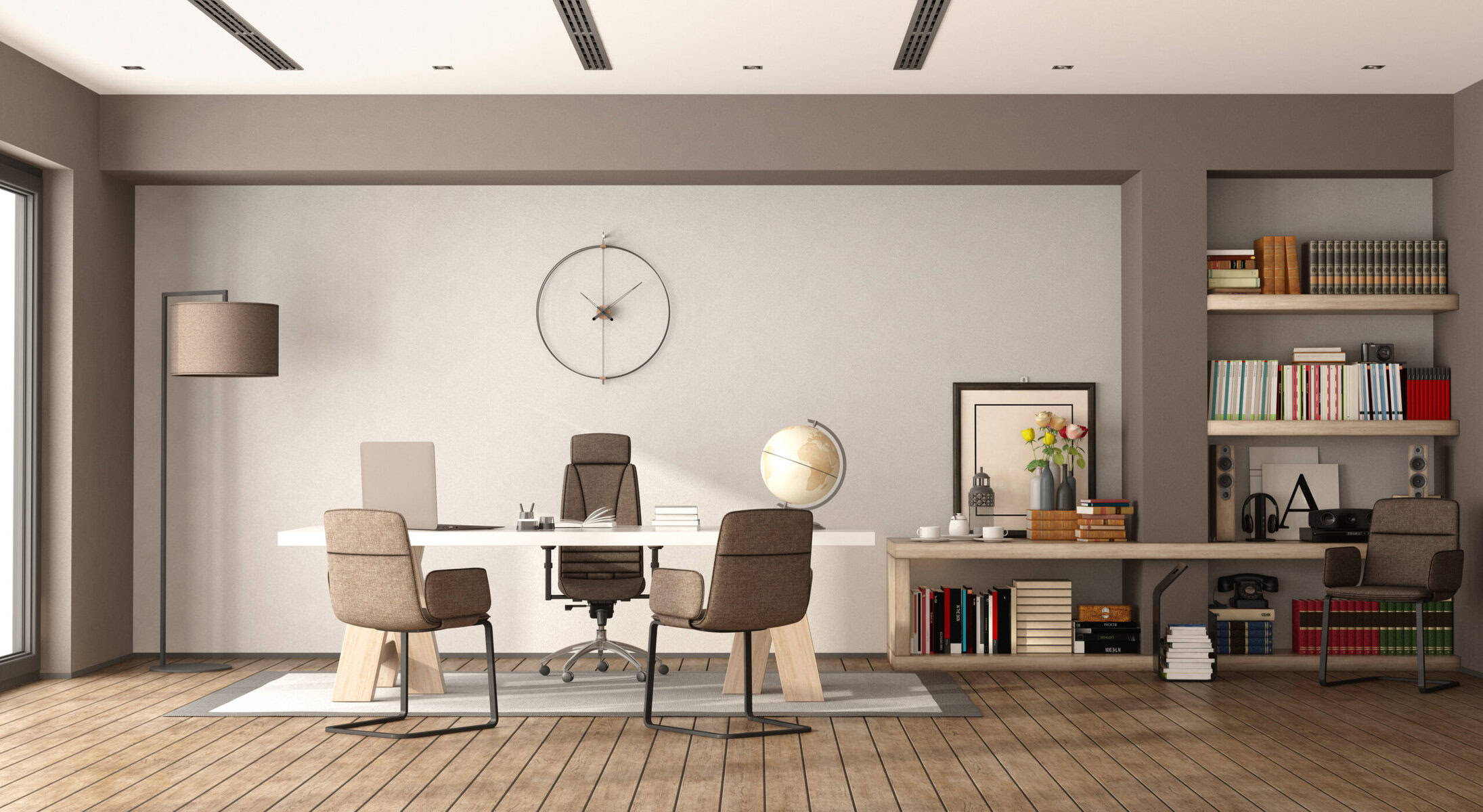 Modern office with large desk, chairs, and bookshelves