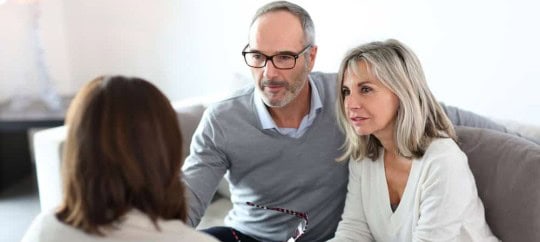 Financial advisors discussing plans with a client at Trust Point.