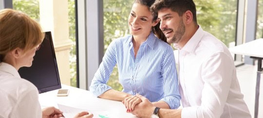 couple sitting in office talking to financial advisor; what happens if you die without a will