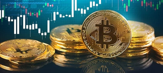 Bitcoin coins with financial chart background for digital currency trading.