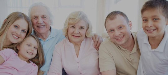 Happy multigenerational family smiling together for Trust Point.