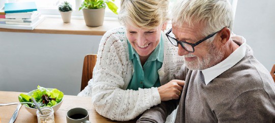 elderly couple smiling