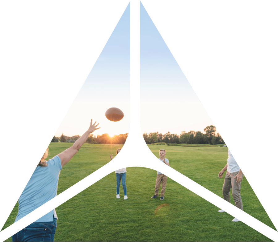 Triangle shape over an image of family throwing football