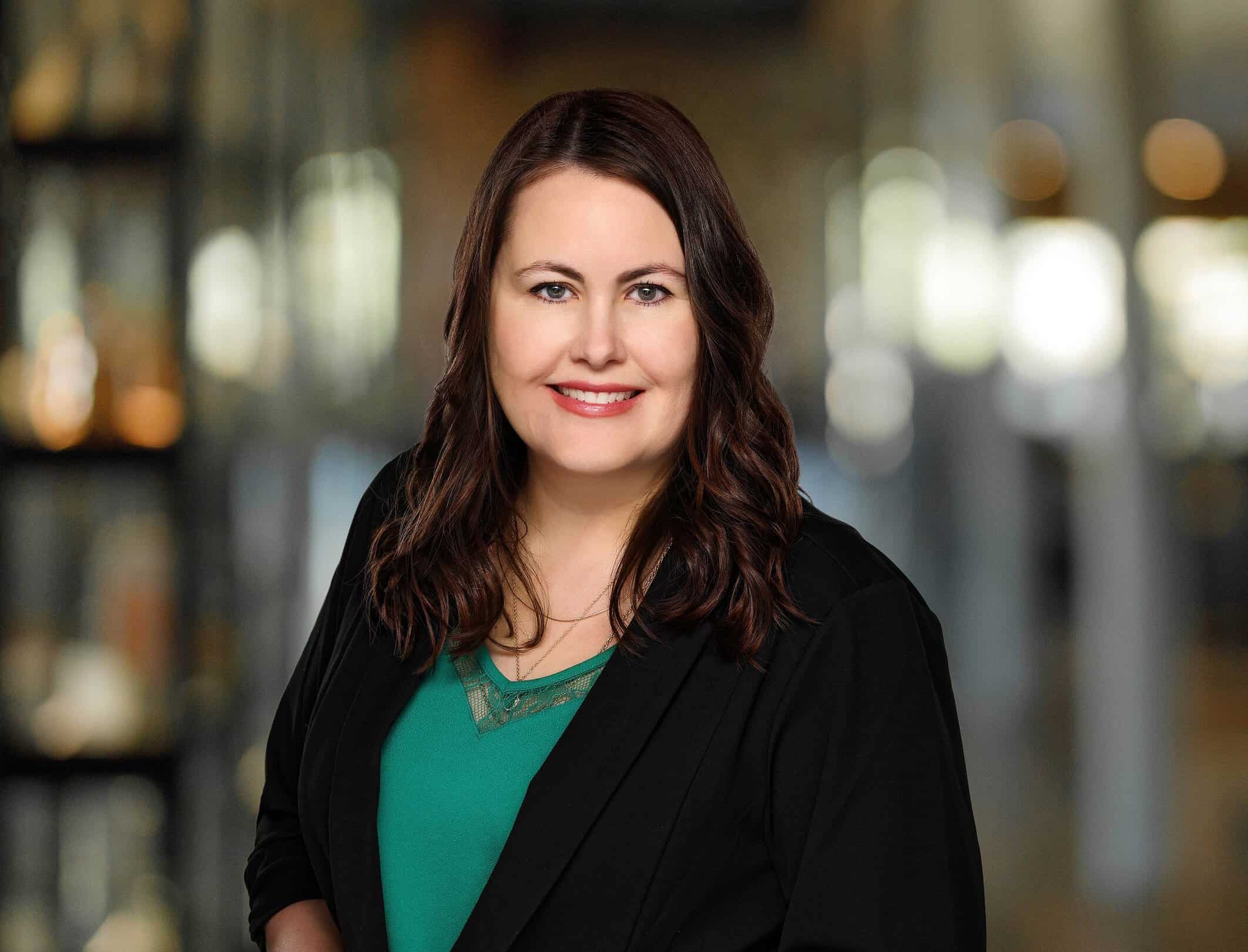 Professional portrait of a woman in business attire at Trust Point.