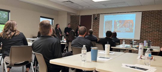 Young Professionals listening to a presentation