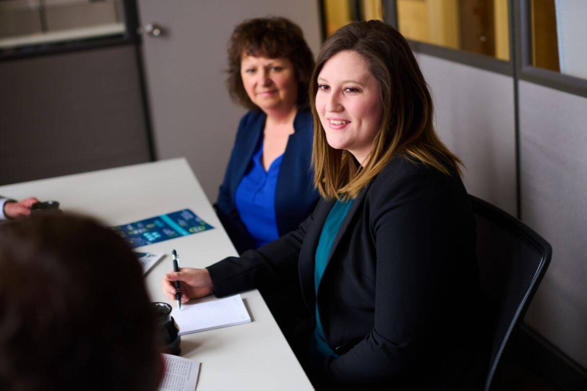 2 women in business professional clothes