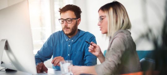 business owners looking at a computer