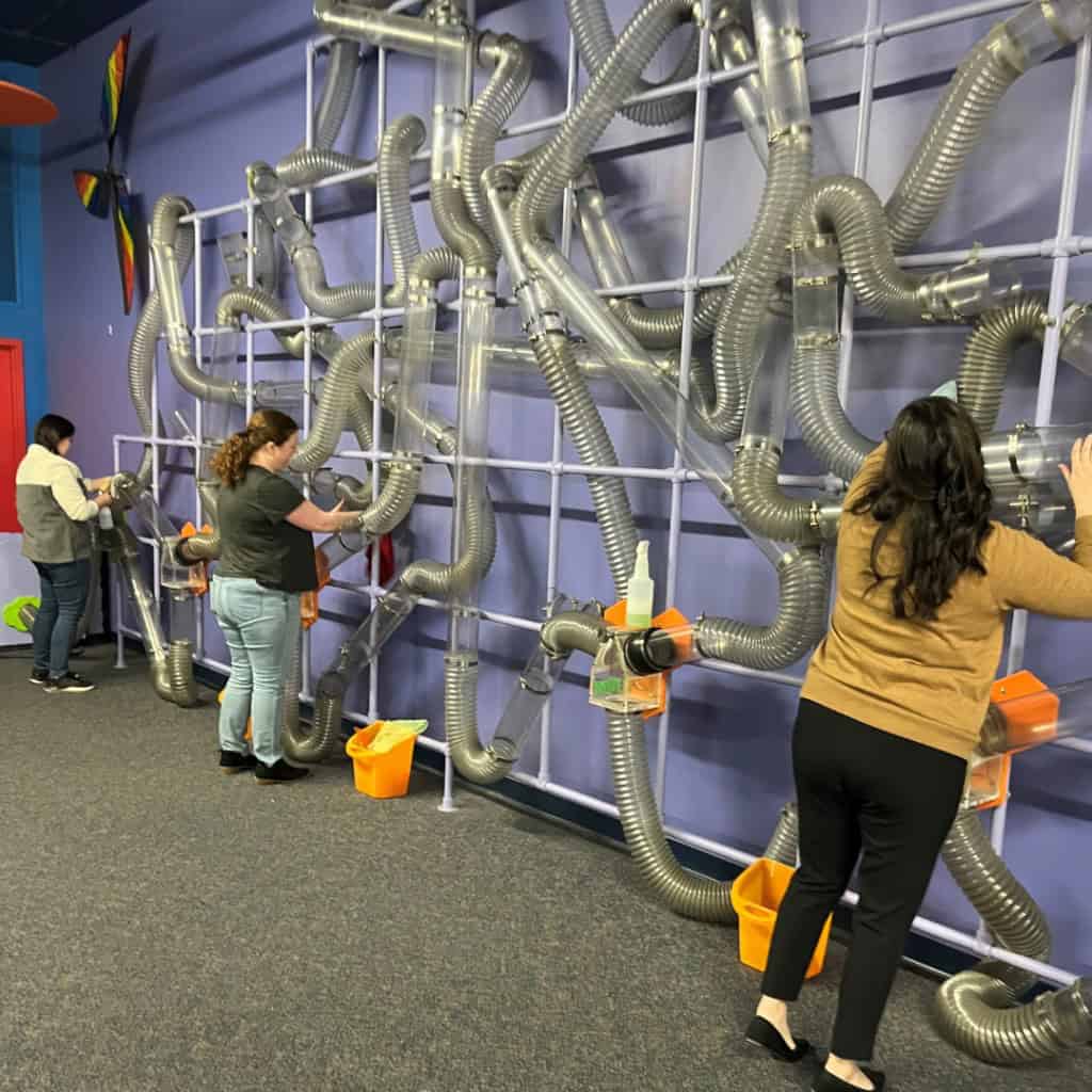3 Trust Point Young Professionals cleaning at the Childrens Museum of La Crosse
