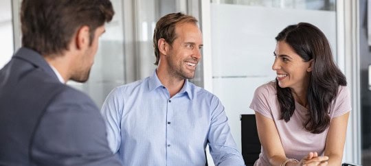Middle-aged couple at financial meeting