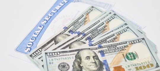 100 dollar bills and a social security card