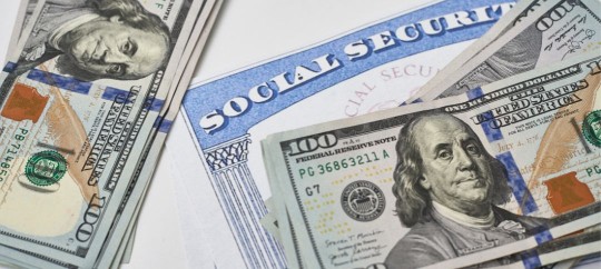 United States 100 dollar bills and social security card